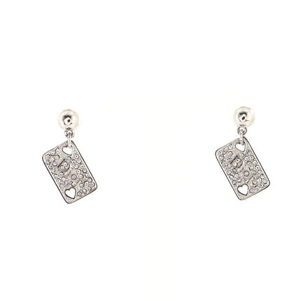Dior hearts playing cards earrings with crystals, says Dior in center